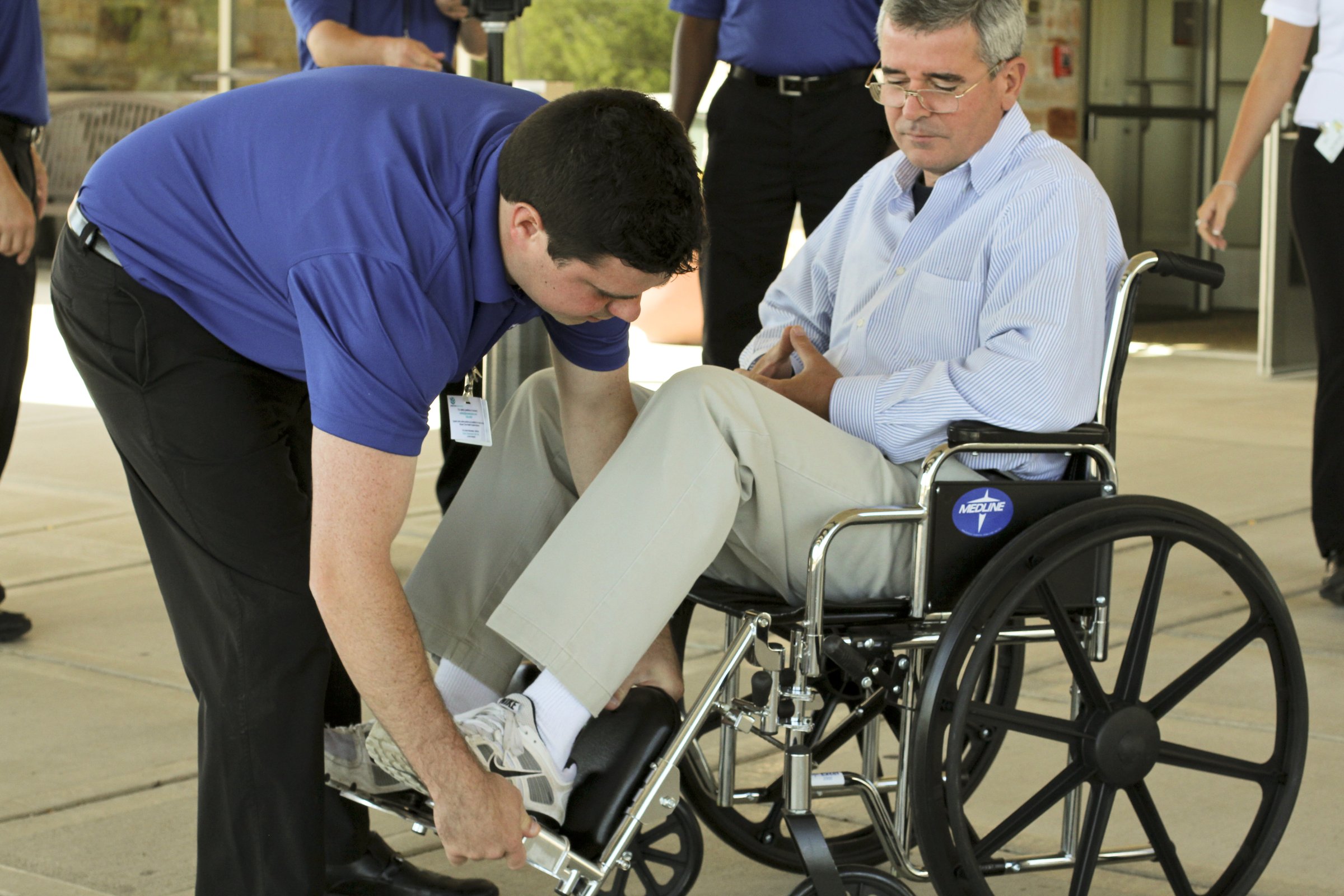 HealthPark associate assisting a resident using a wheelchair